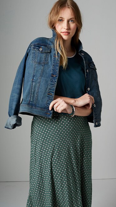 Shop our layered tee, printed A-line midi skirt, classic denim jacket and Peaceful Plains semiprecious stretch bangles