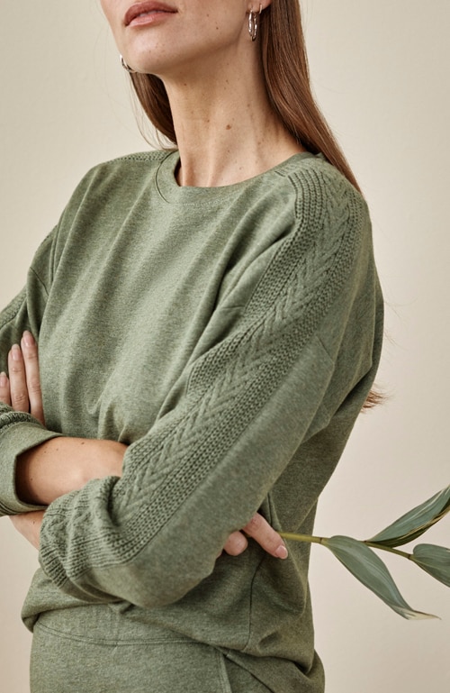 Shop our sweater-trimmed sweatshirt