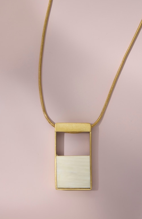 Shop our natural horn & rosewood reversible necklace 