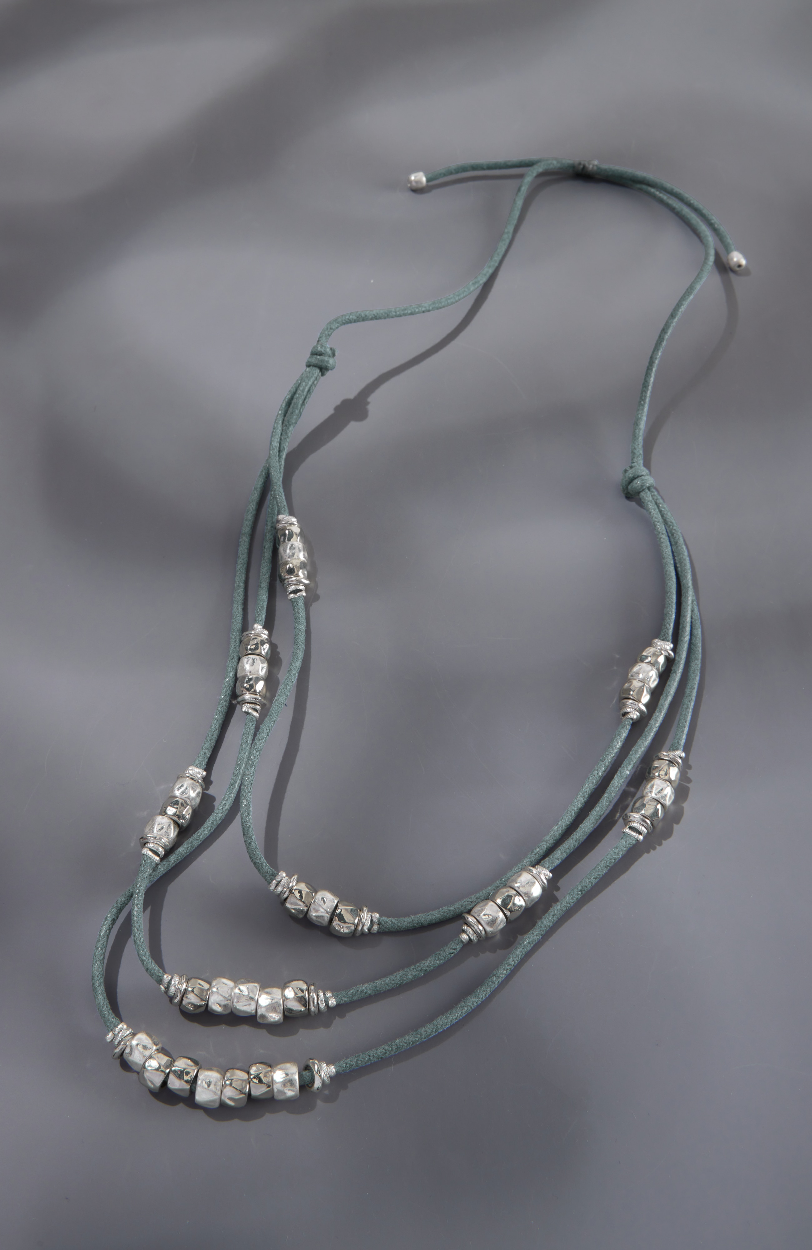 textured-metal-and-cord statement necklace