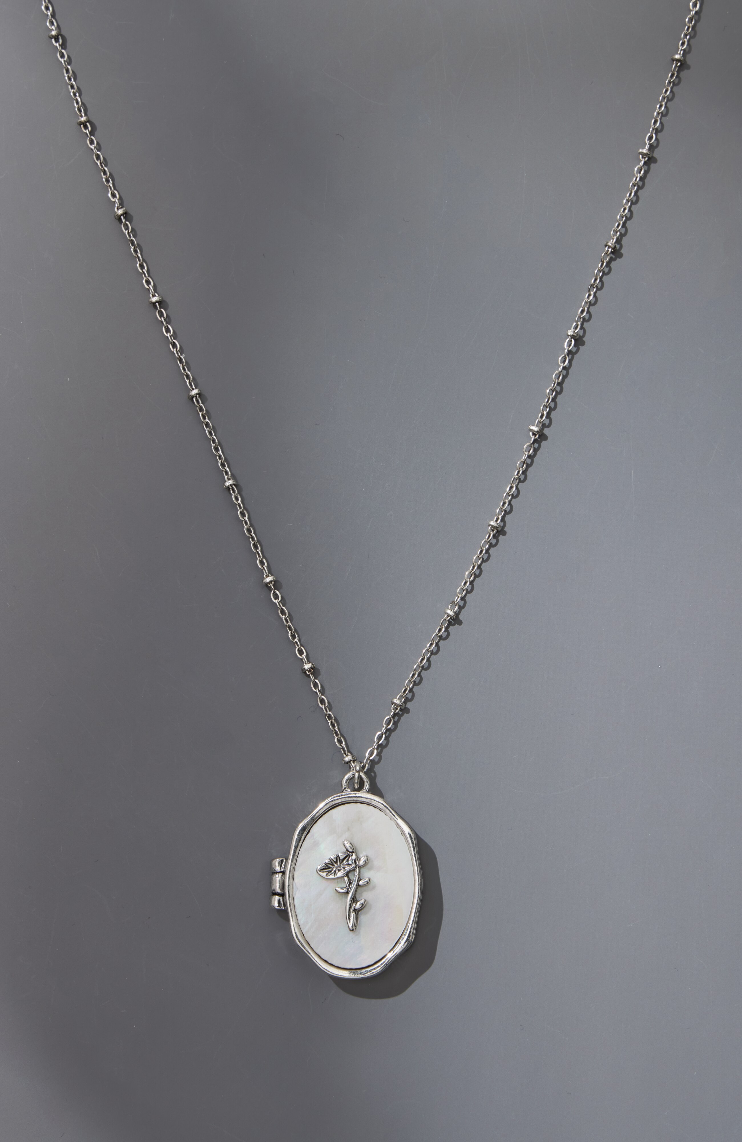 compassion fund mother-of-pearl locket
