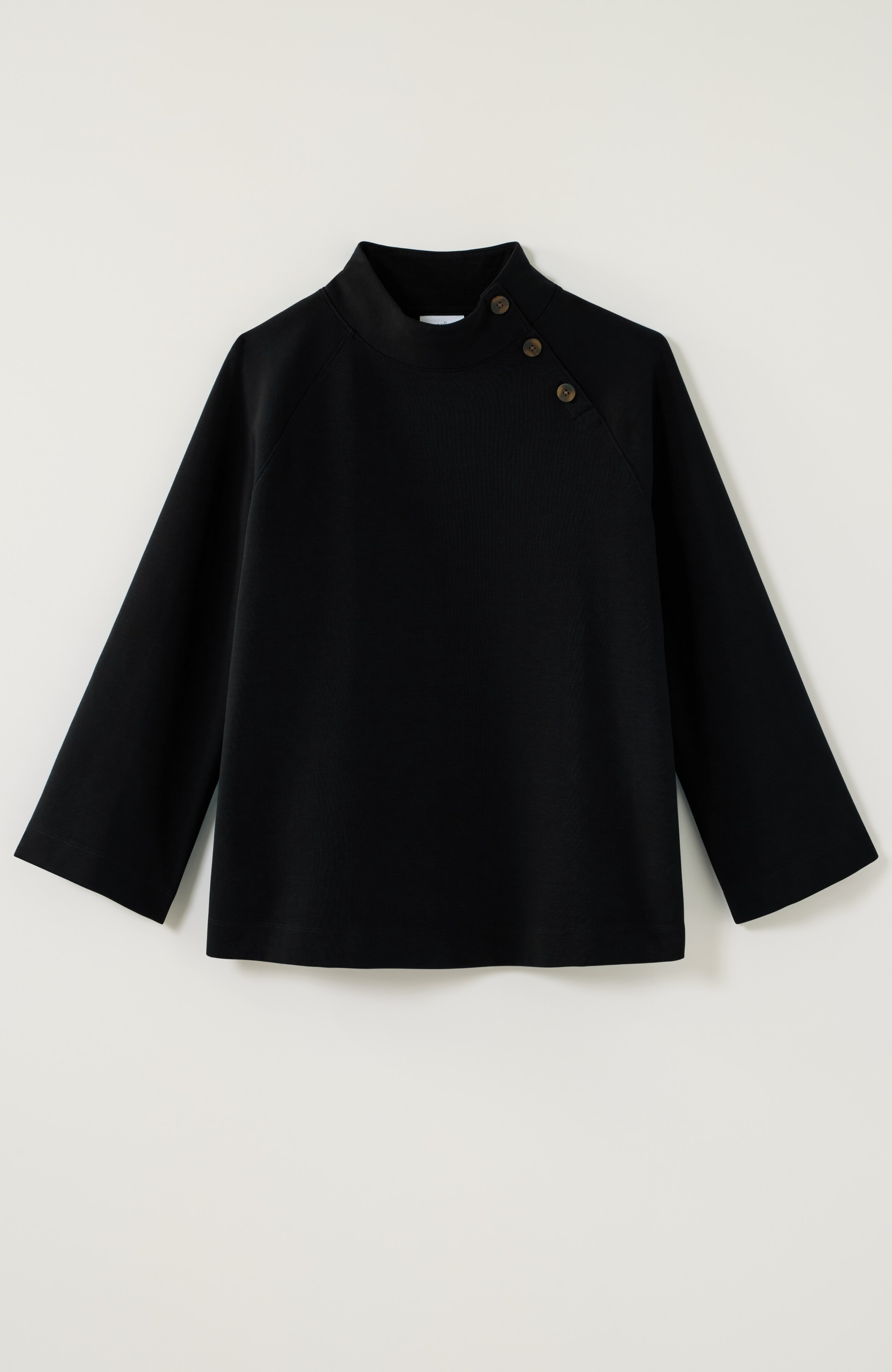 buttoned-shoulder knit top