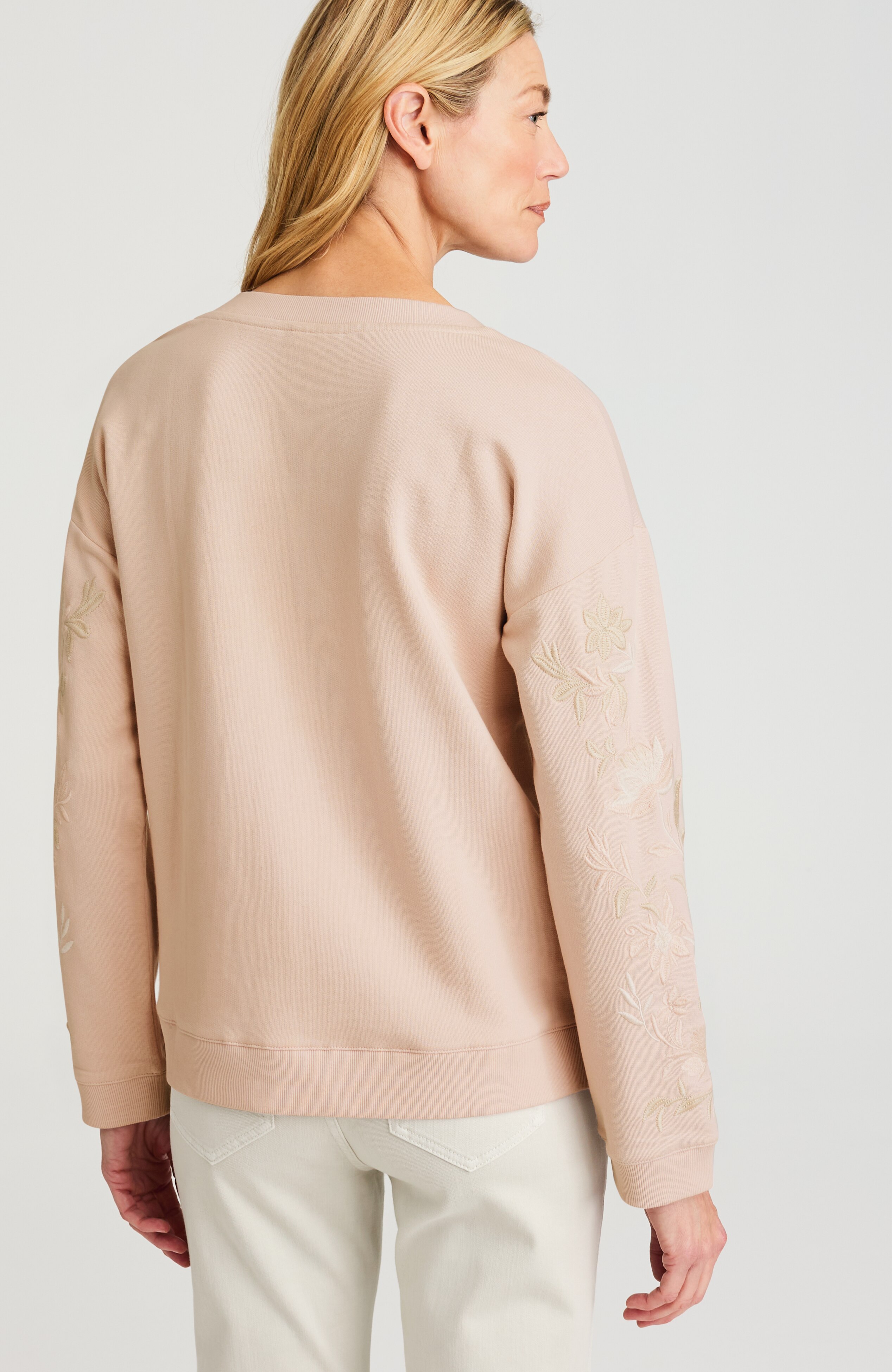 intricately embroidered sweatshirt