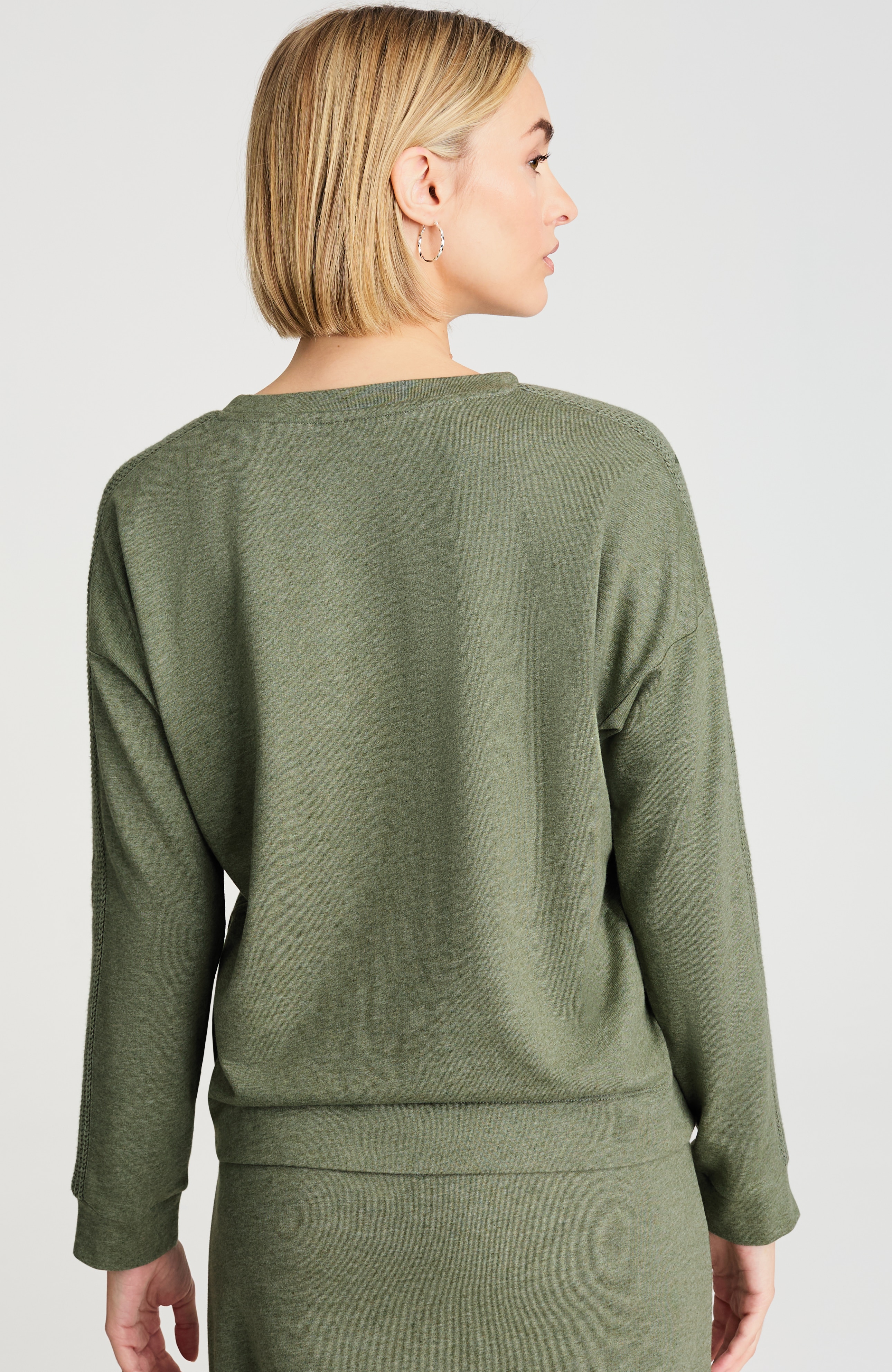 sweater-trimmed sweatshirt