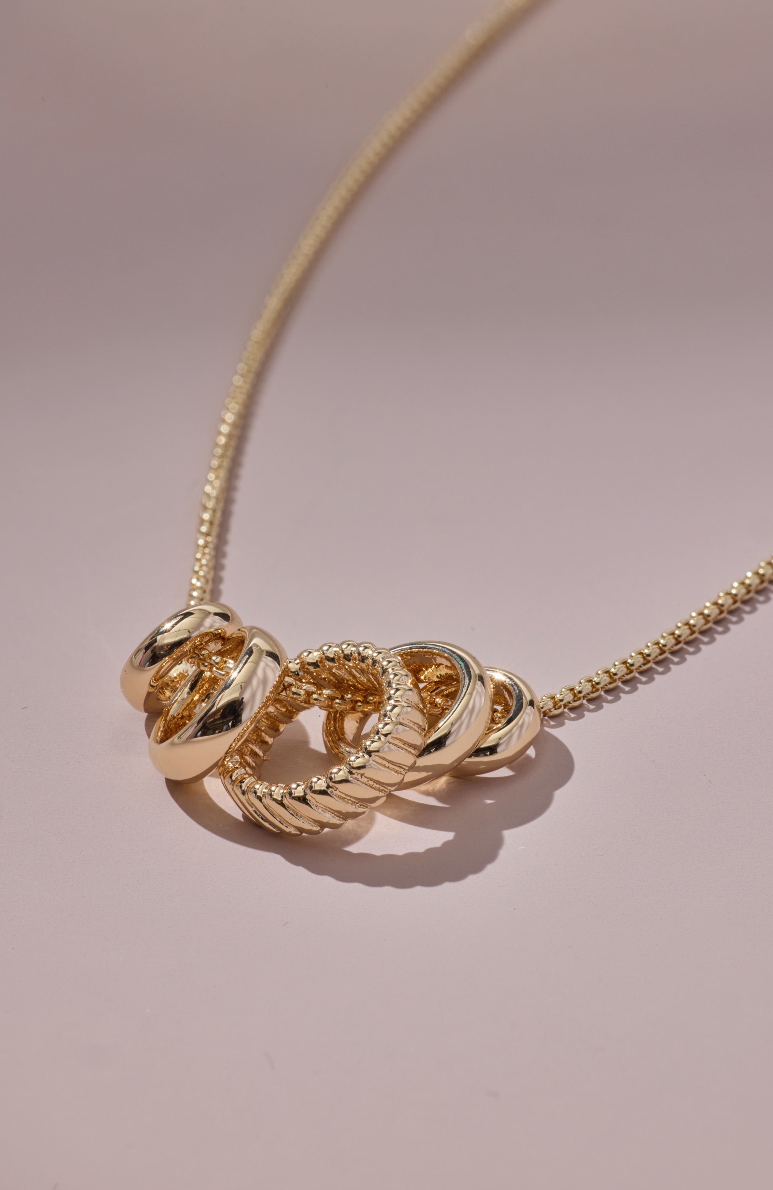 compassion fund five golden rings necklace