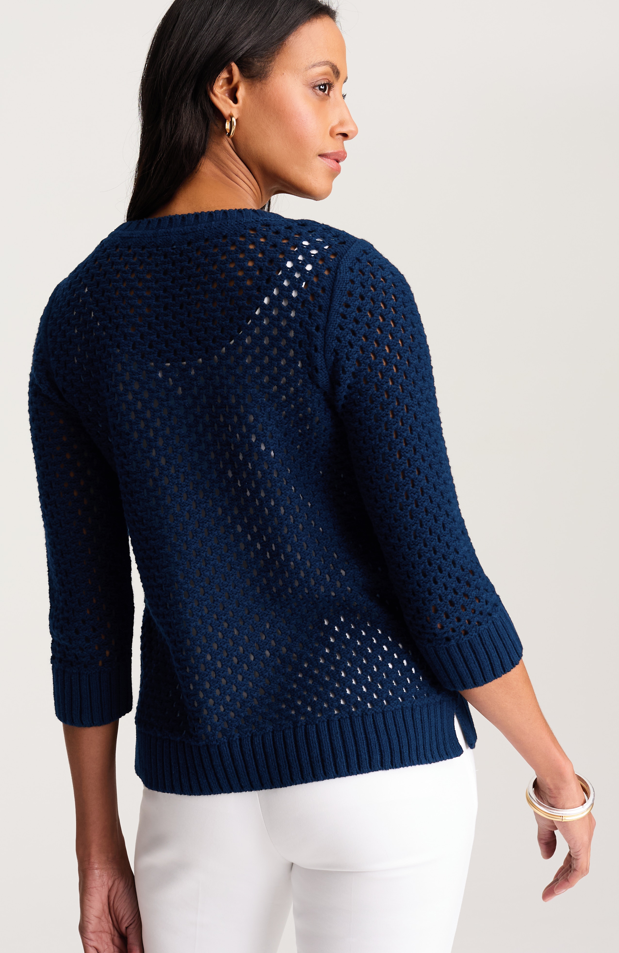 open-knit cabled sweater