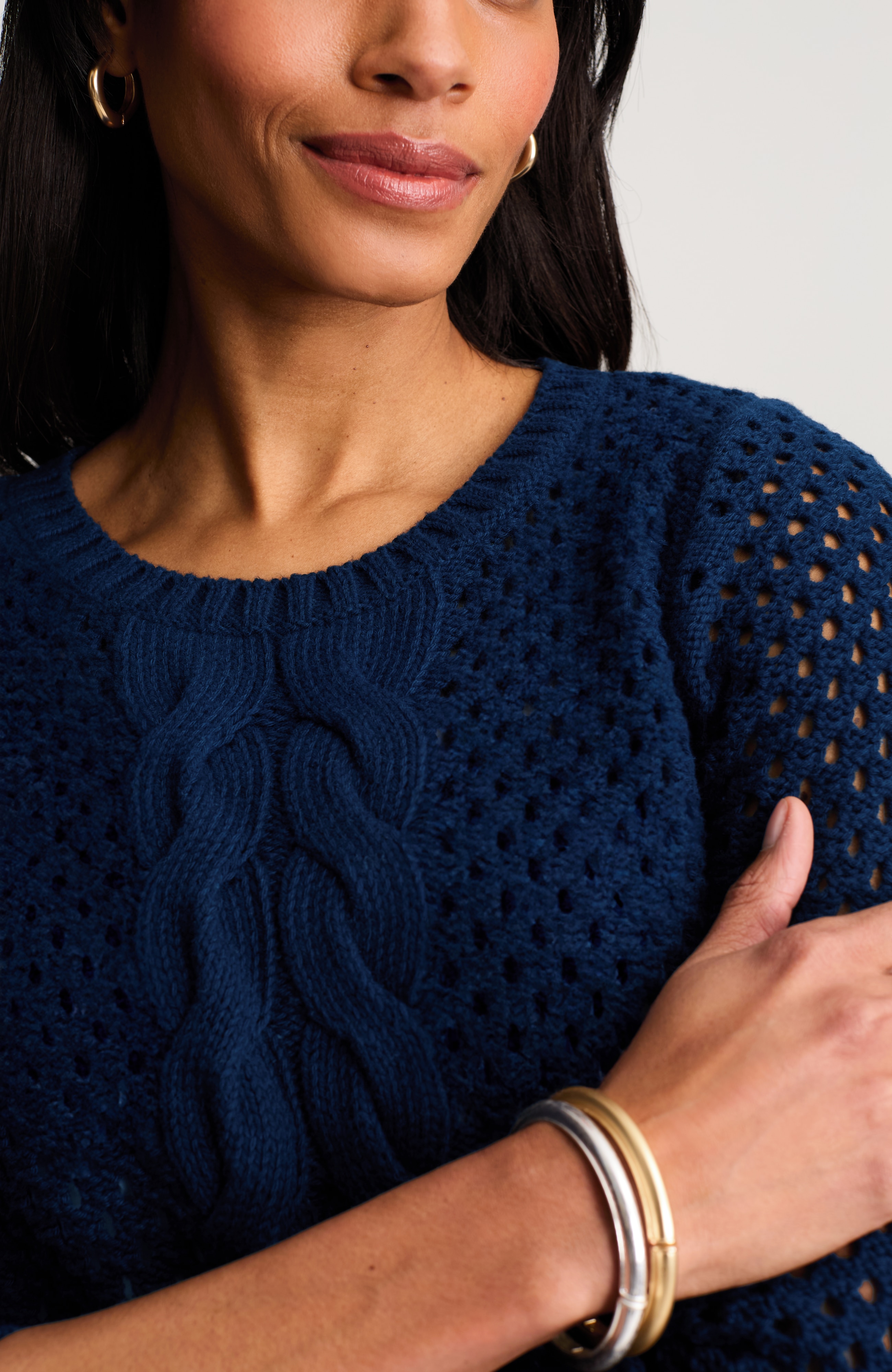 open-knit cabled sweater