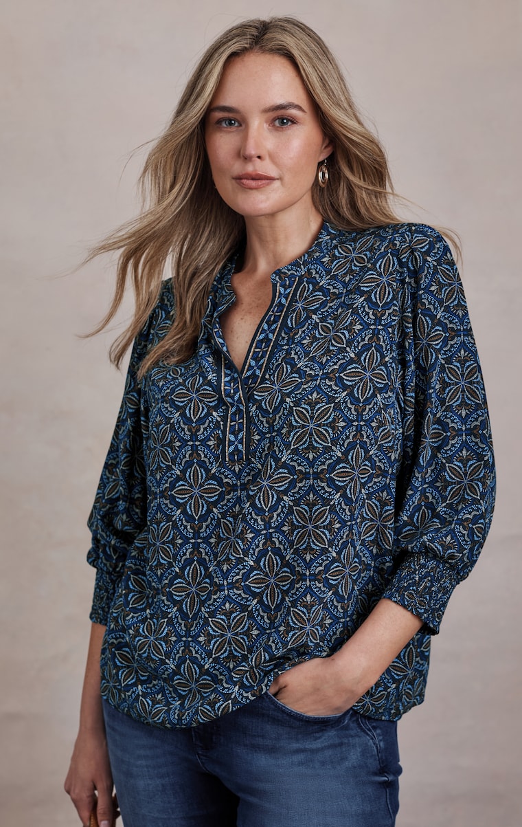Primary view of the border-printed smocked-sleeve top